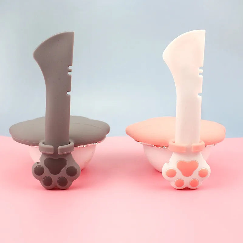 Compact silicone paw-shaped pet food dispenser & can opener, great for pet supplies.