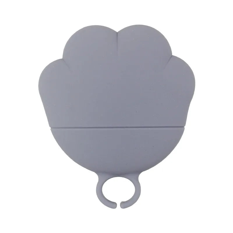 Innovative silicone pet food dispenser & can opener, blue, for hygienic pet feeding.