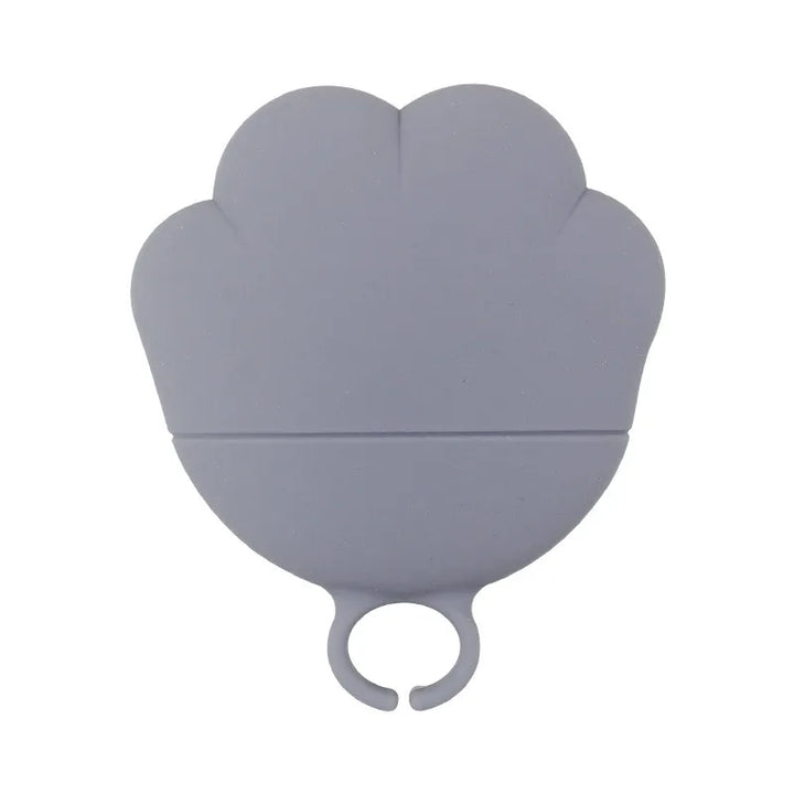 Innovative silicone pet food dispenser & can opener, blue, for hygienic pet feeding.