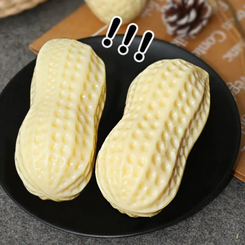 Dog enrichment peanut toy with built-in squeaker, promoting play and good dental hygiene.