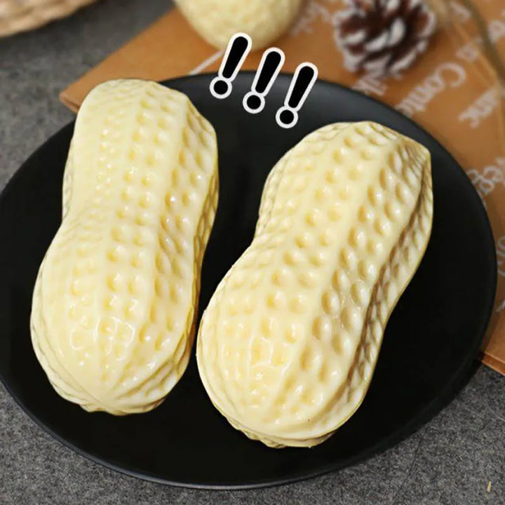 Dog enrichment peanut toy with built-in squeaker, promoting play and good dental hygiene.