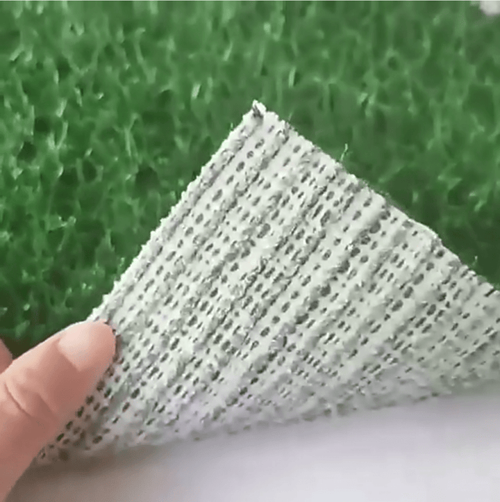Artificial grass dog mat with robust leak protection and odor control for easy pet relief area cleaning.