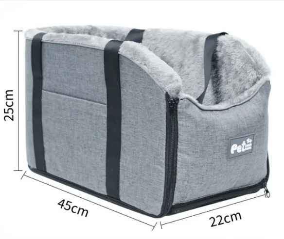 Cat relaxing in a secure pet car booster seat with elevated view, cream interior.