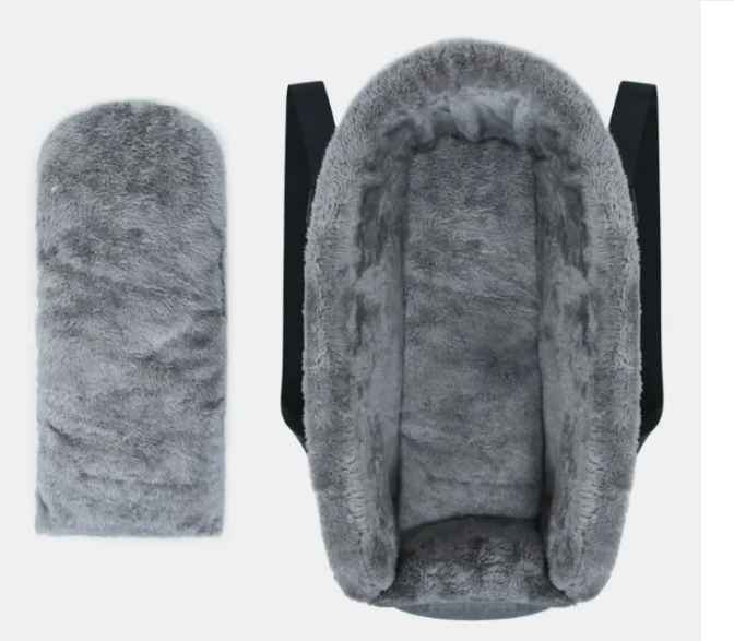 Pet car booster seat showing adjustable straps and non-slip bottom, ensuring pet travel safety.