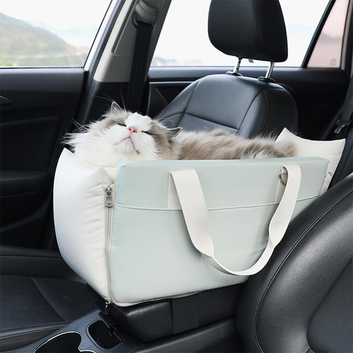Waterproof pet console carrier, a portable dog car seat and cat travel solution.