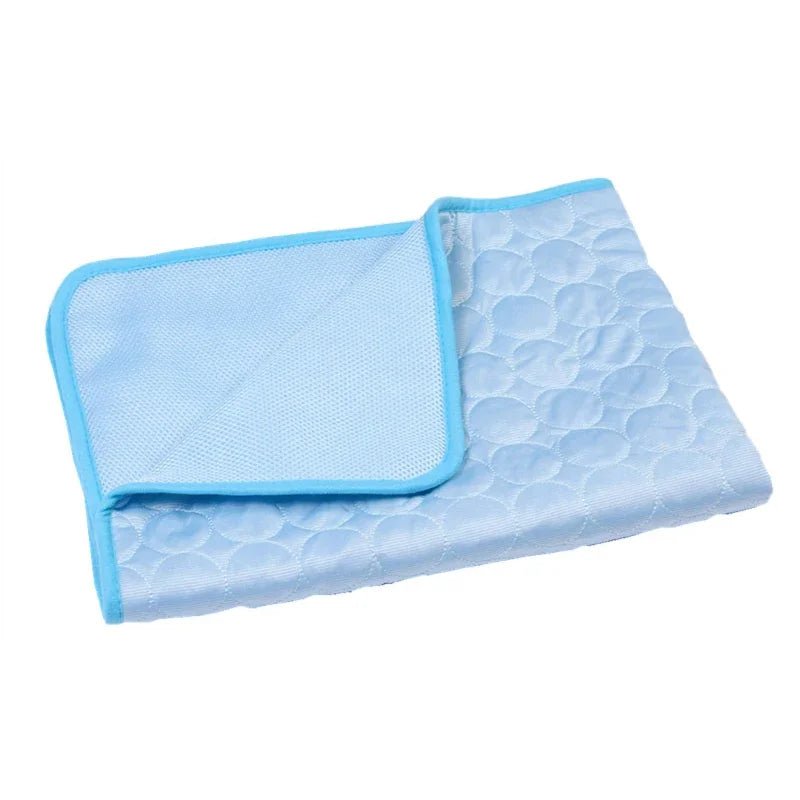 A dog comfortably resting on a large pet cooling mat, essential summer pet accessory