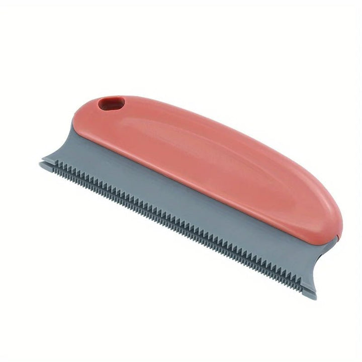 Cat enjoying a gentle deshedding session with the grooming brush, reducing pet hair