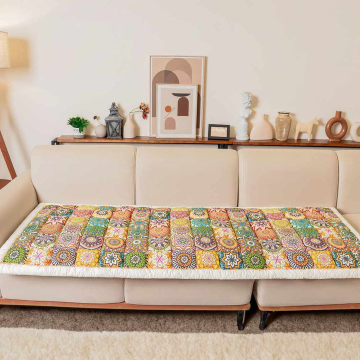 Non-slip scratch resistant cotton couch cover for pets, shown on a dark brown leather sofa
