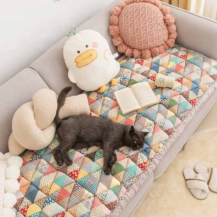 Detail view of a pet-friendly sofa protector's non-slip backing and durable cotton material