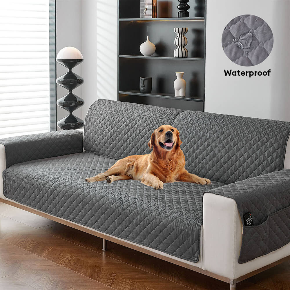 Pet-friendly waterproof quilted sofa cover in gray protecting a couch from spills & pet hair.