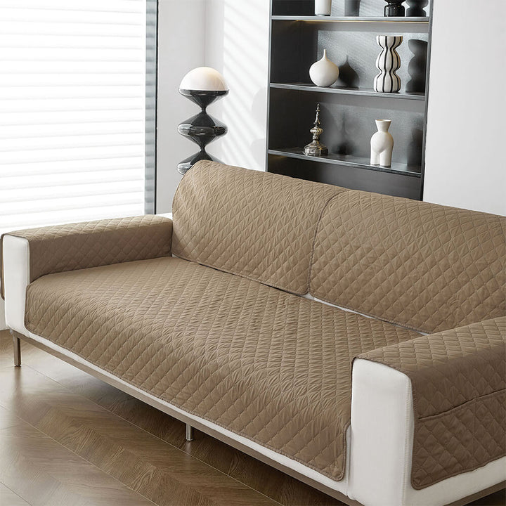 Packaging of a pet-friendly waterproof non-slip sofa cover, emphasizing furniture protection.