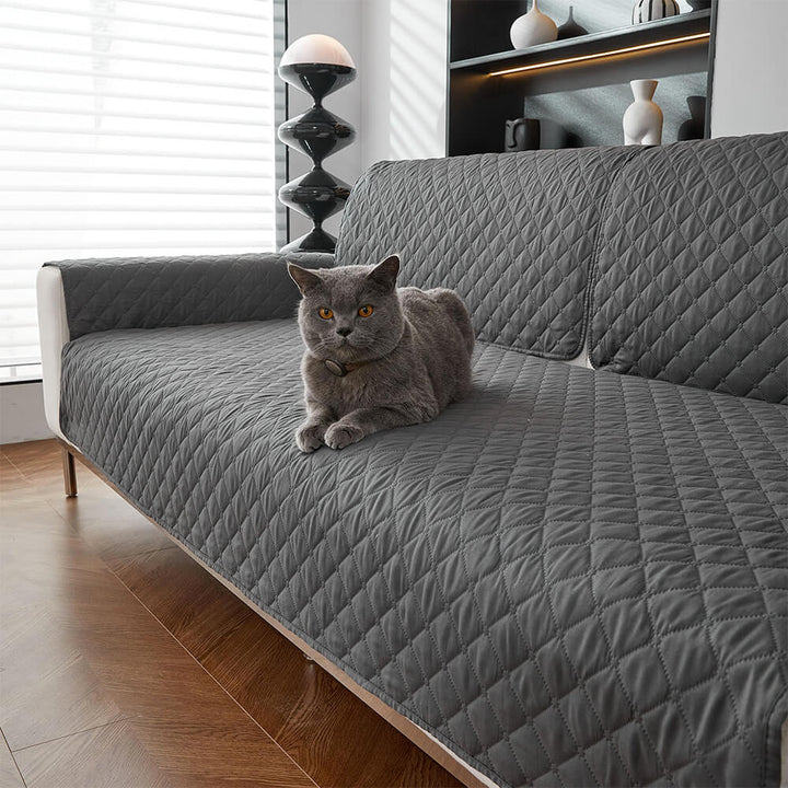 Non-slip pet protector sofa cover with elastic straps for secure furniture protection, home decor.