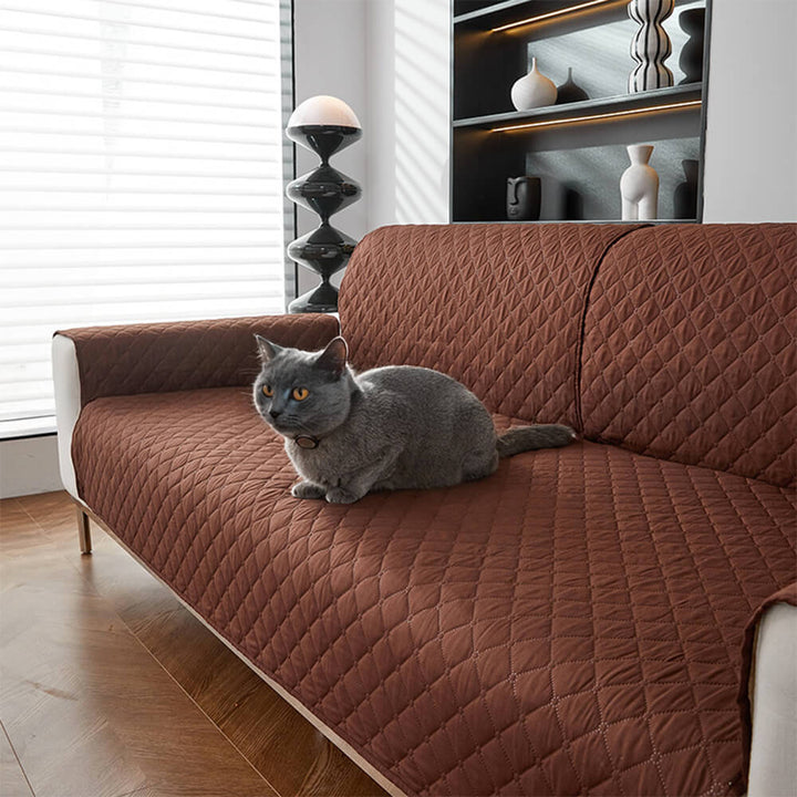 Close-up of quilted waterproof couch cover fabric, showing durable, pet-friendly material.