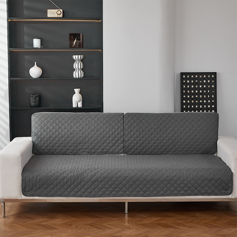 Chocolate brown waterproof non-slip sofa cover protecting a three-seater couch, machine washable.