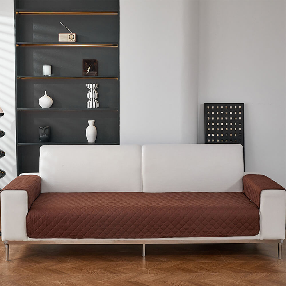 Washable quilted pet sofa cover, highlighting its ease of maintenance for busy pet owners.