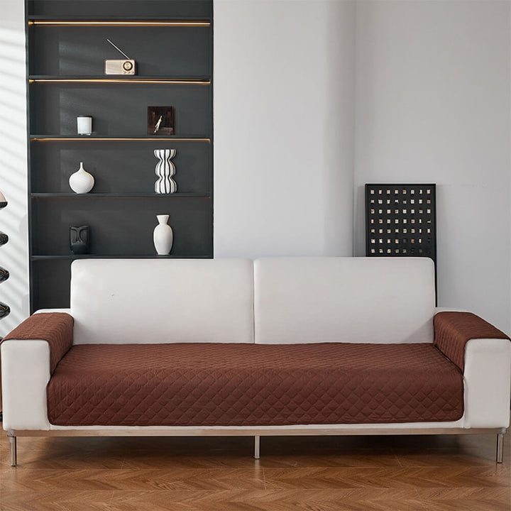 Washable quilted pet sofa cover, highlighting its ease of maintenance for busy pet owners.