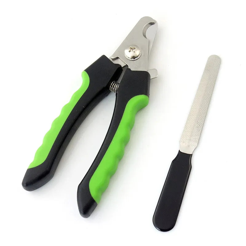 Close-up of self-cleaning button on a pet grooming brush with nail clippers set