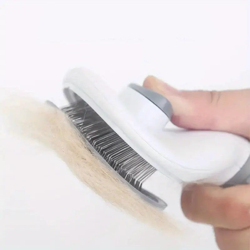 Close-up of pet grooming brush with stainless steel bristles, quick release for easy cleaning