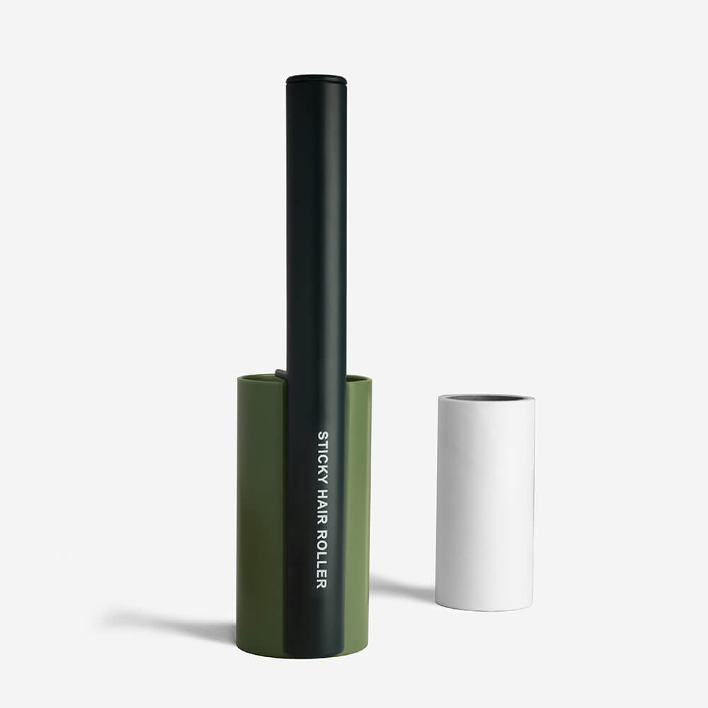 Pet grooming essential: a Lint Roller effectively removing fur from a dark fabric, showing its power