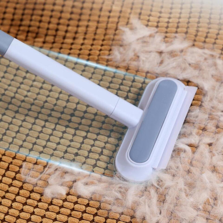 Hand using a reusable pet hair remover on a car seat, demonstrating easy fur and lint clean-up