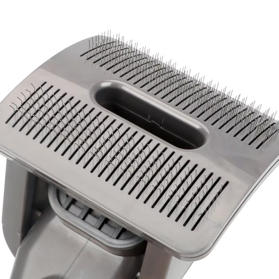 Hand holding a pet hair vacuum attachment, demonstrating ease of use for pet grooming and fur removal.