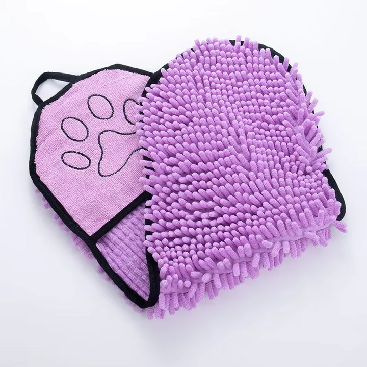 Cat being gently dried by owner using a super absorbent microfiber pet towel with built-in glove