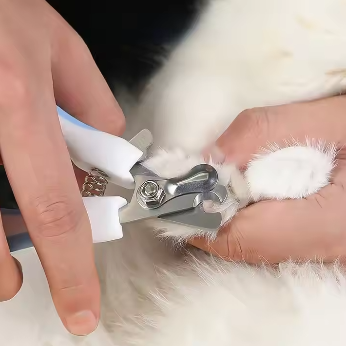 Ergonomic pet nail clippers for dog and cat paw care, featuring a safety lock mechanism.