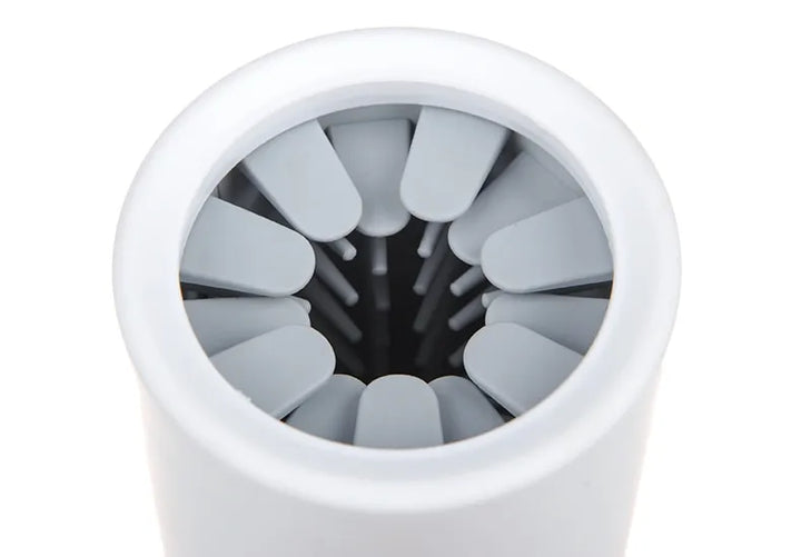 Components of a pet paw cleaner: soft silicone brushes and outer casing, for easy and portable pet care.
