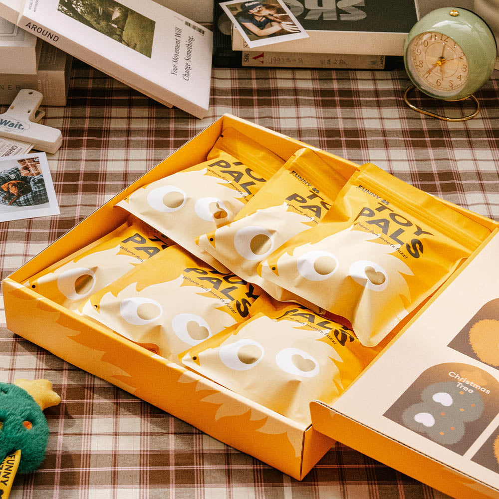 Children's hands unboxing the Pet Plush Squeaker Toy Box Set, exciting pet gifts for holidays.