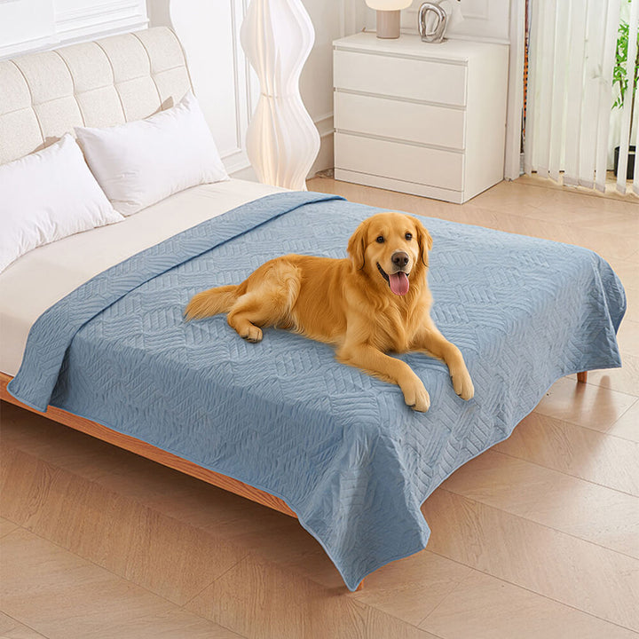 Beige Pet Proof Water-Resistant Blanket draped over a bed, ideal for dog or cat owners.