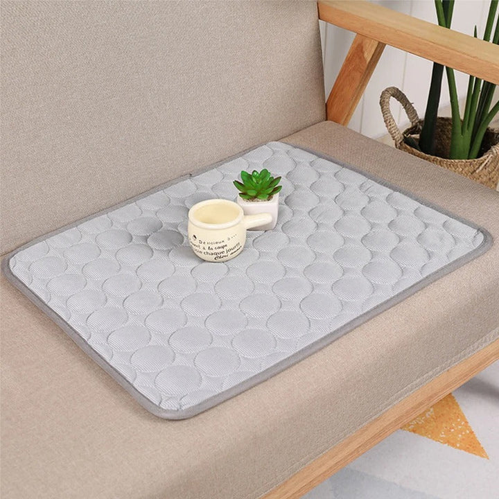 Pet cooling pad in an indoor setting, demonstrating its use as a comfortable, easy-clean cooling bed