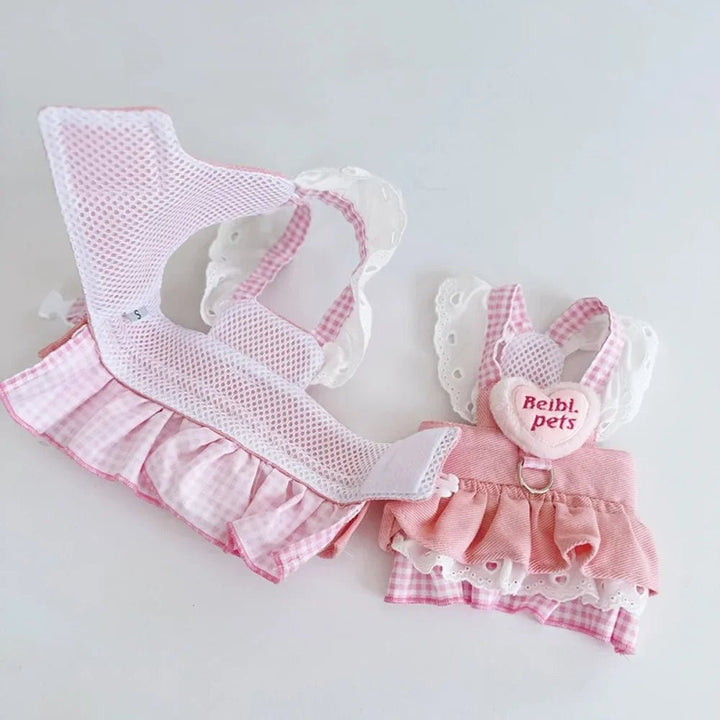 Close-up of pink dog harness showcasing breathable fabric and strong D-rings for pet control.