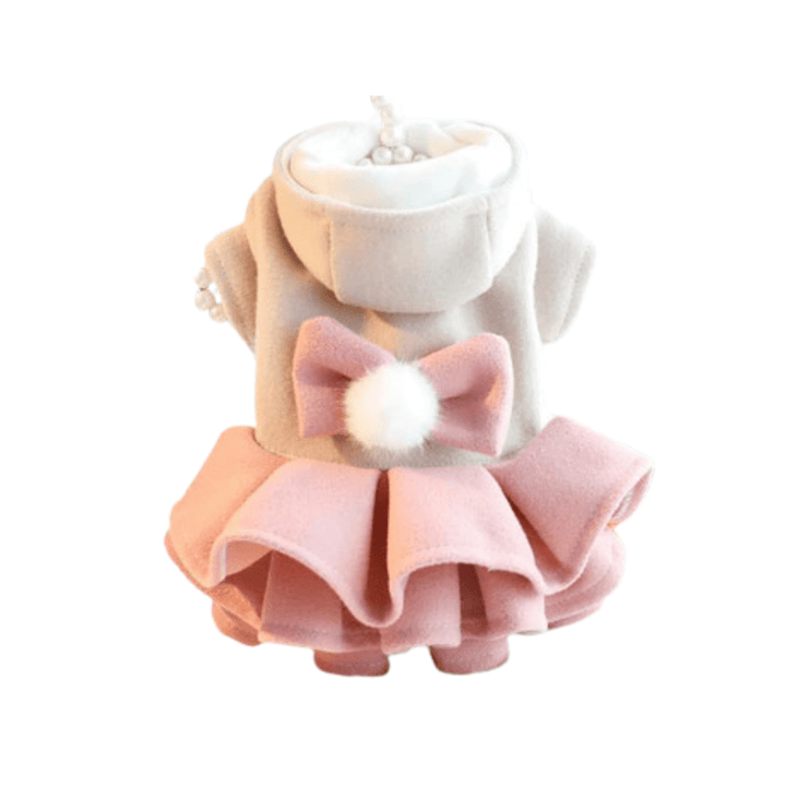 Small dog wearing a cozy pink fleece dress jacket with a cute bow, autumn pet fashion