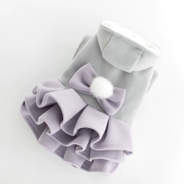 Front view of a pink fleece dog dress jacket with a prominent bow, warm small dog attire