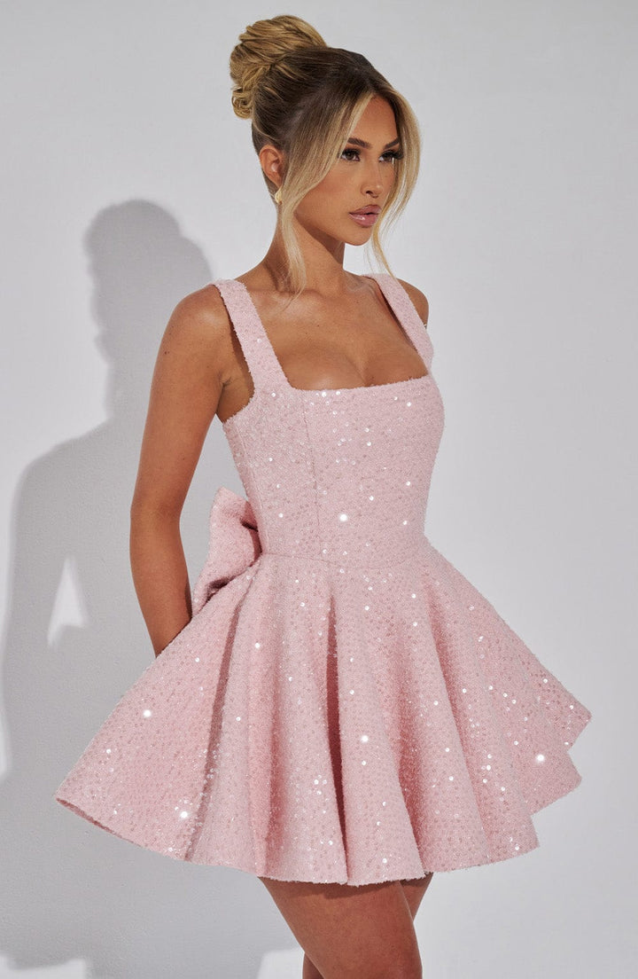 Shine bright in this pink sequin homecoming skater dress for women, complete with a beautiful bow.