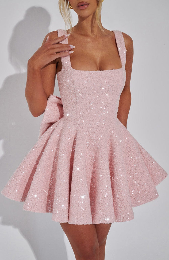 Feminine white sequin dance dress, mini length with a flared skater skirt and cute bow accent.