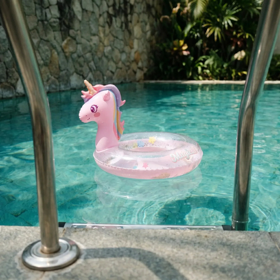 Pink Sparkella inflatable unicorn pool float for kids' summer water play and beach day fun.