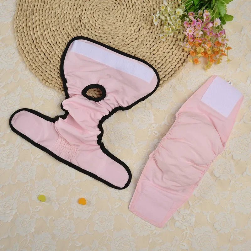 Close-up of pink washable dog diaper showing adjustable fasteners for female pets
