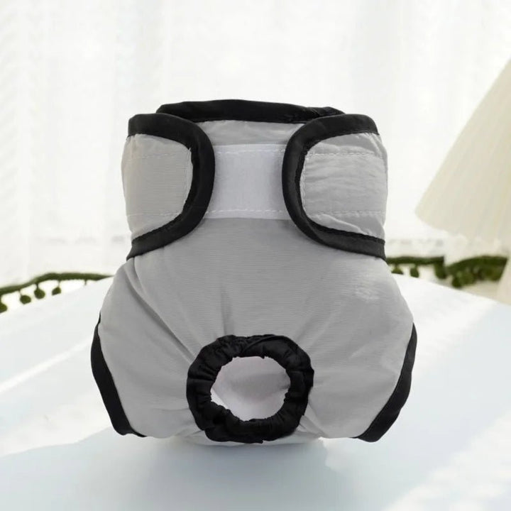 Folded reusable pet diaper, highlighting its absorbent layers for female dog incontinence