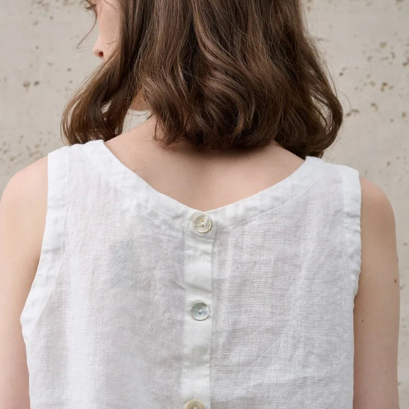 Comfortable women's relaxed fit crop top. Asymmetric hem, sleeveless. Perfect for modern summer casual fashion.