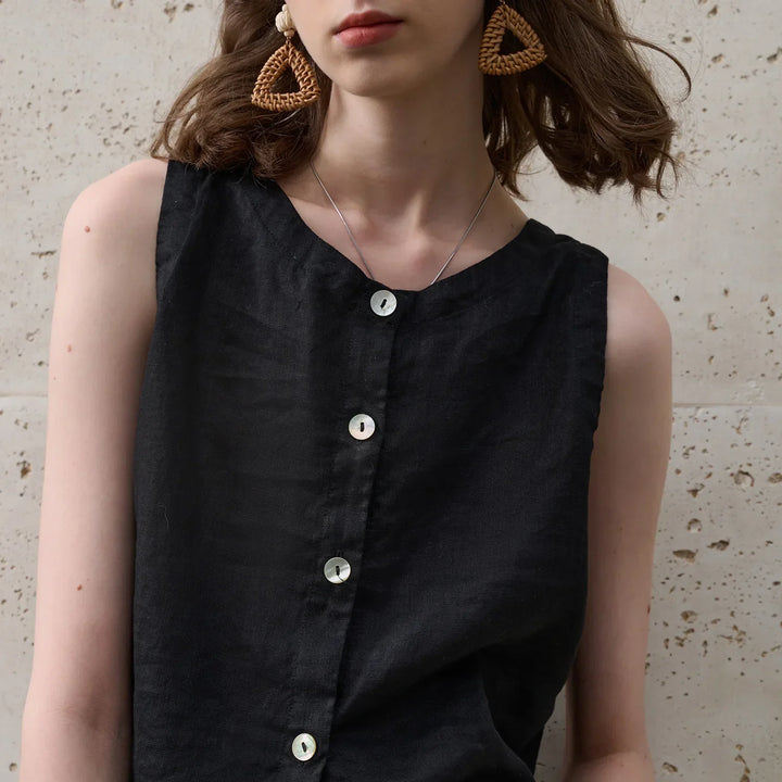 White asymmetric hem crop top for women. Sleeveless, crew neck, modern design, perfect for stylish summer outfits.