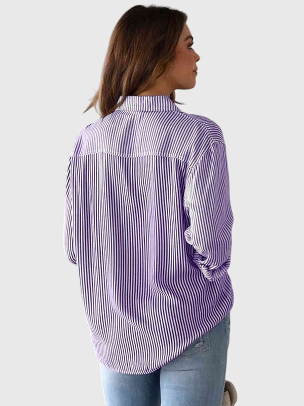 Vibrant blue striped collared shirt for women, a versatile button-down blouse.