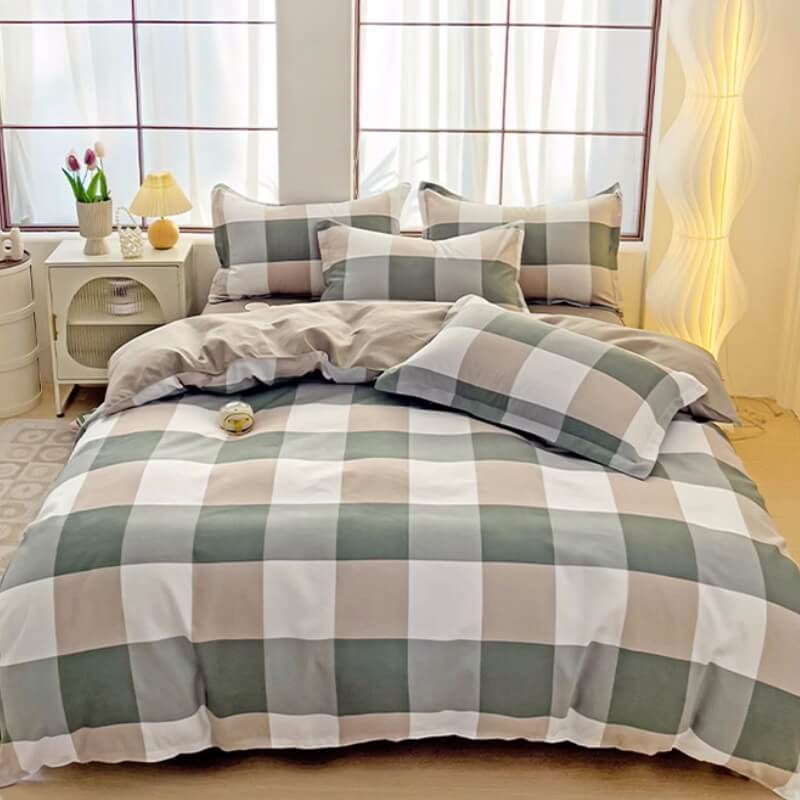 Close-up of breathable polyester sheet set, showcasing its plaid and color block design details