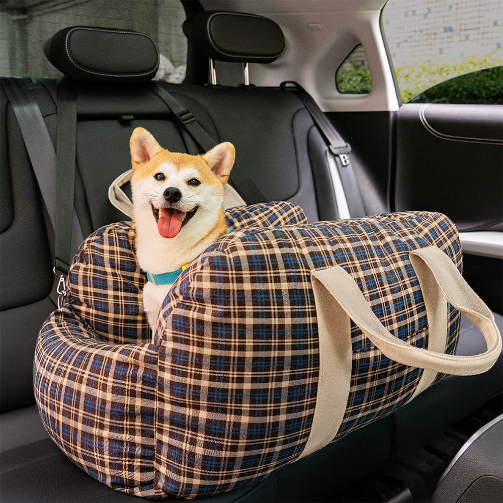 Plaid dog car seat bed for small dogs, ensuring pet travel safety and comfort.