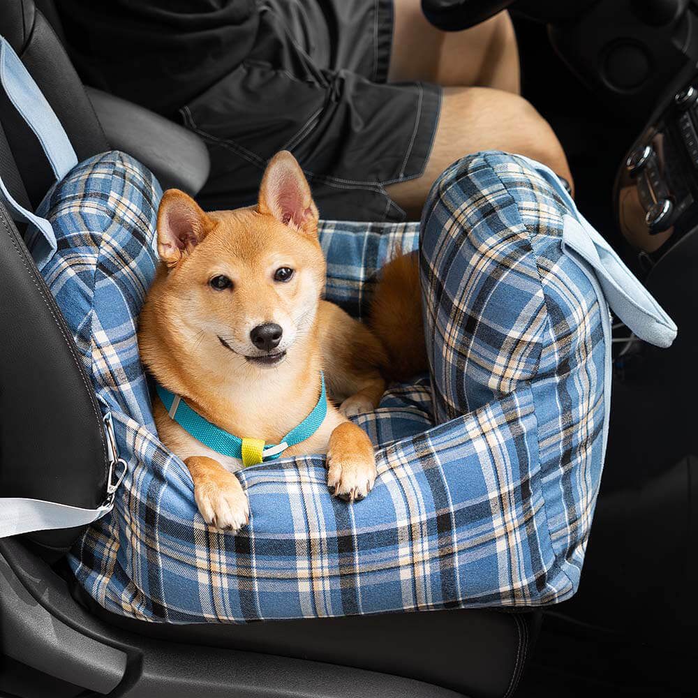 Small dog travel bed: plaid car seat, ensuring safety and comfort for your pet.