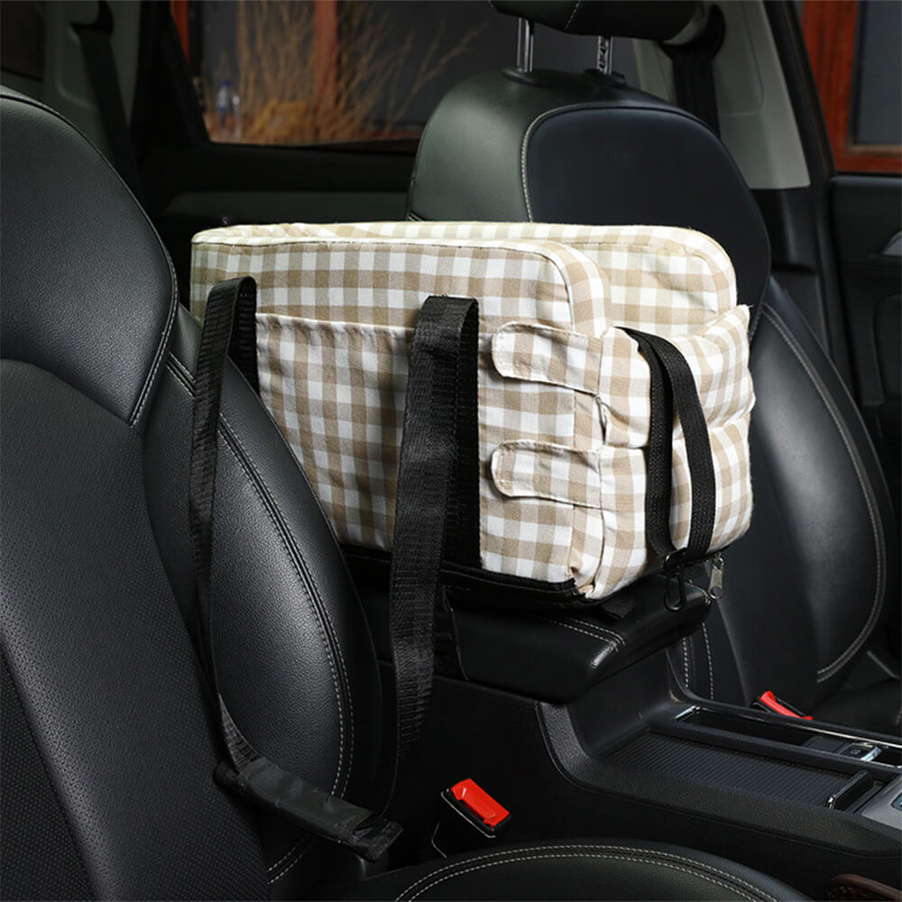 Plaid pet car seat for small dogs, providing a secure and comfortable elevated ride during travel.