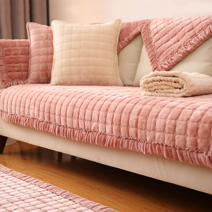 Detail of anti-slip backing on a velvet sectional furniture protector, ensuring a secure fit
