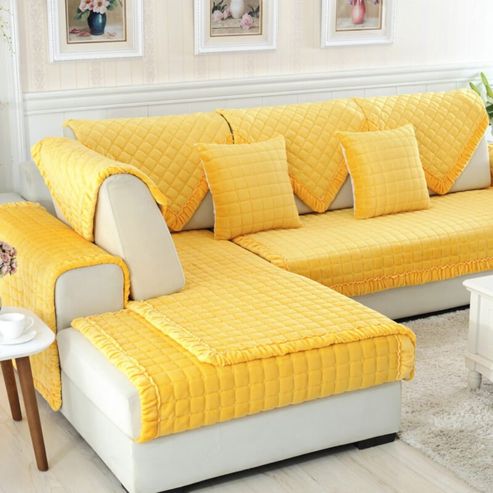 Stylish beige velvet slipcover on a modern sectional sofa, adding elegance & protection to home