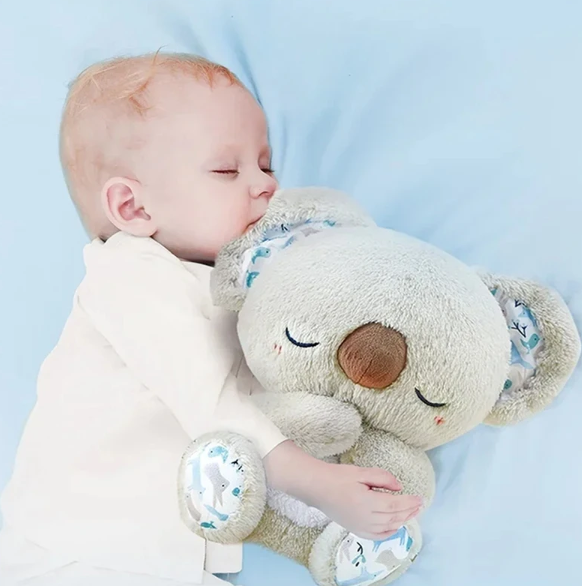 Animated plush koala breathing toy gently moving, promoting calm, sleep aid & anxiety relief for all ages.
