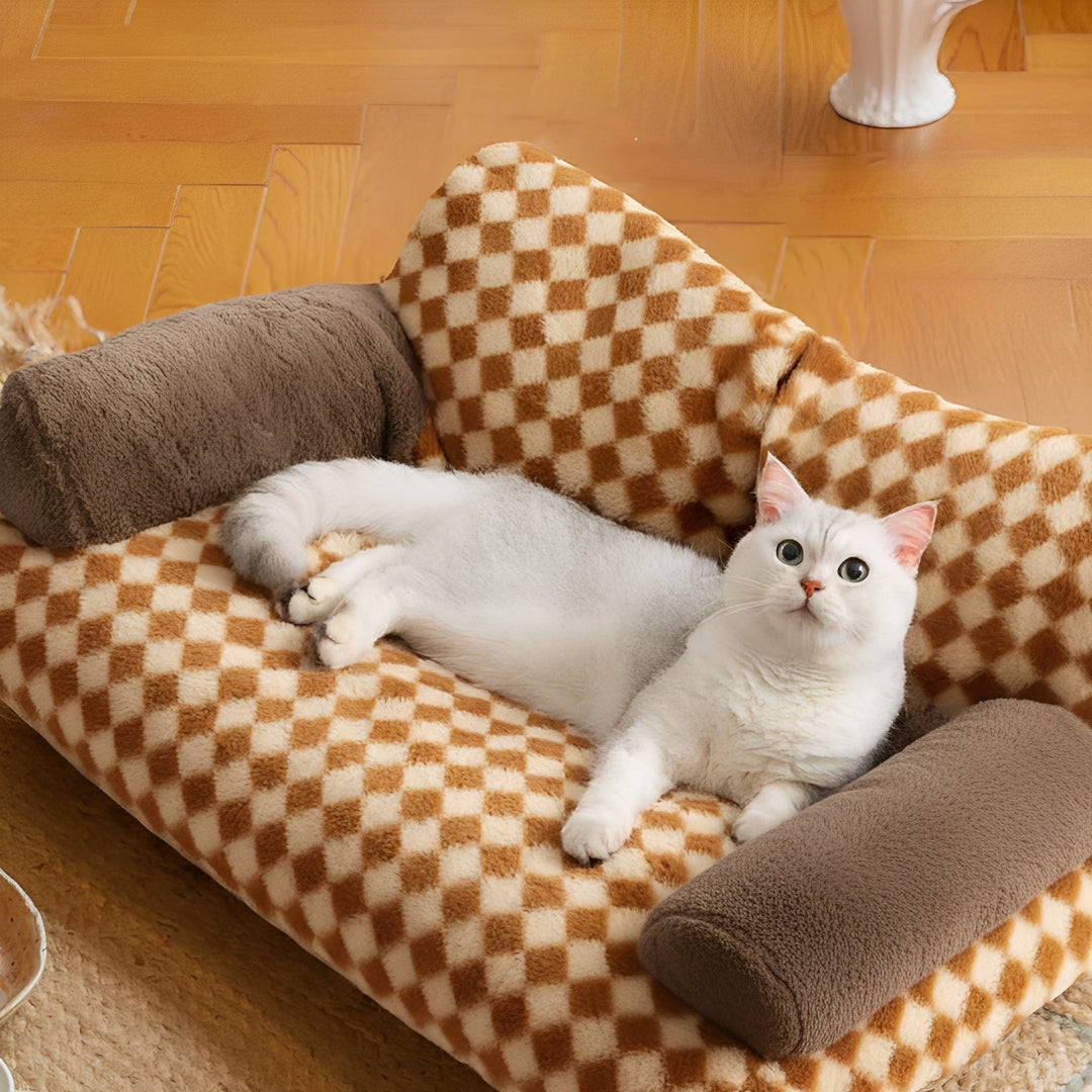 Washable cat bolster bed in a cozy sofa design, perfect pet furniture for cats.
